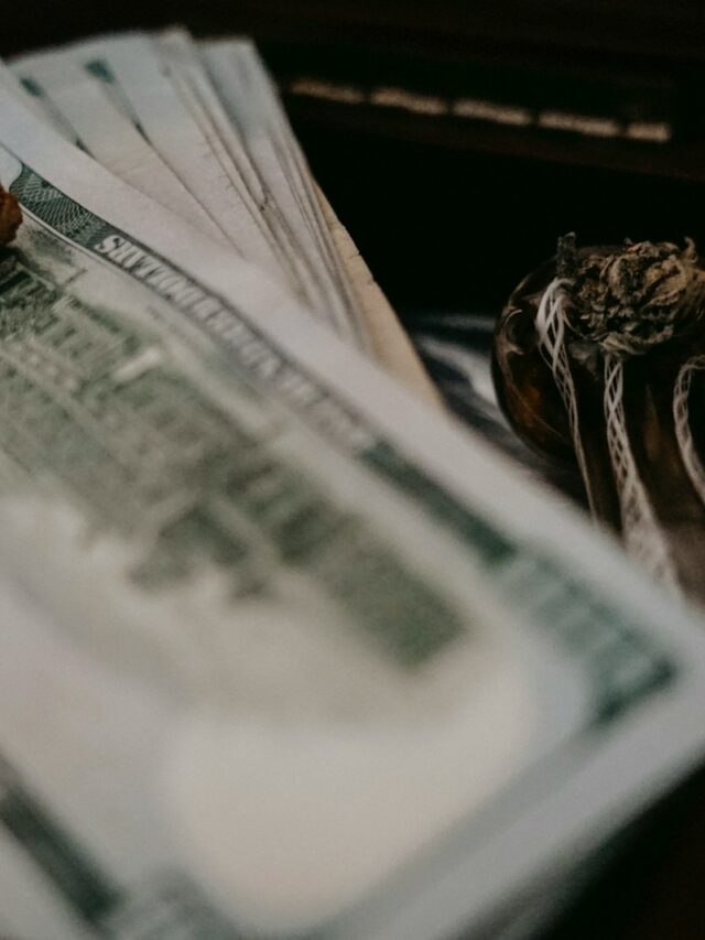 a pile of money sitting on top of a table