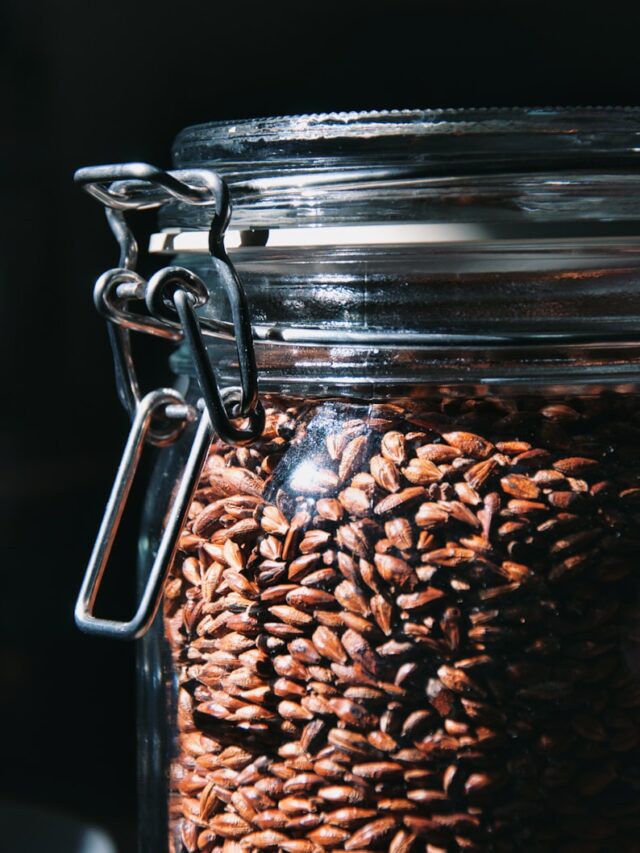 a glass jar filled with lots of nuts