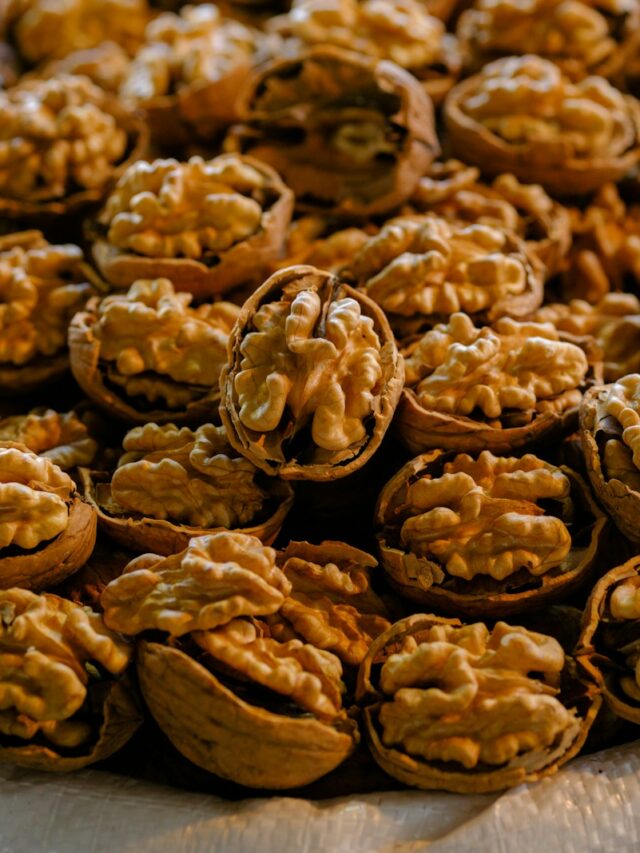 a pile of walnuts sitting on top of a table