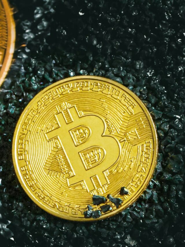 a bitcoin sitting next to a bitcoin on the ground