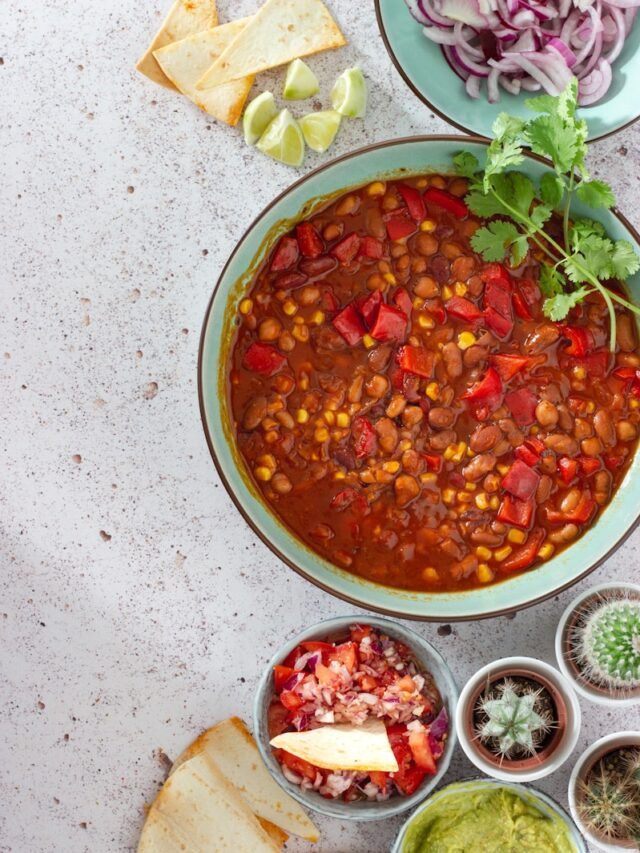 red and green chili peppers in white ceramic bowl