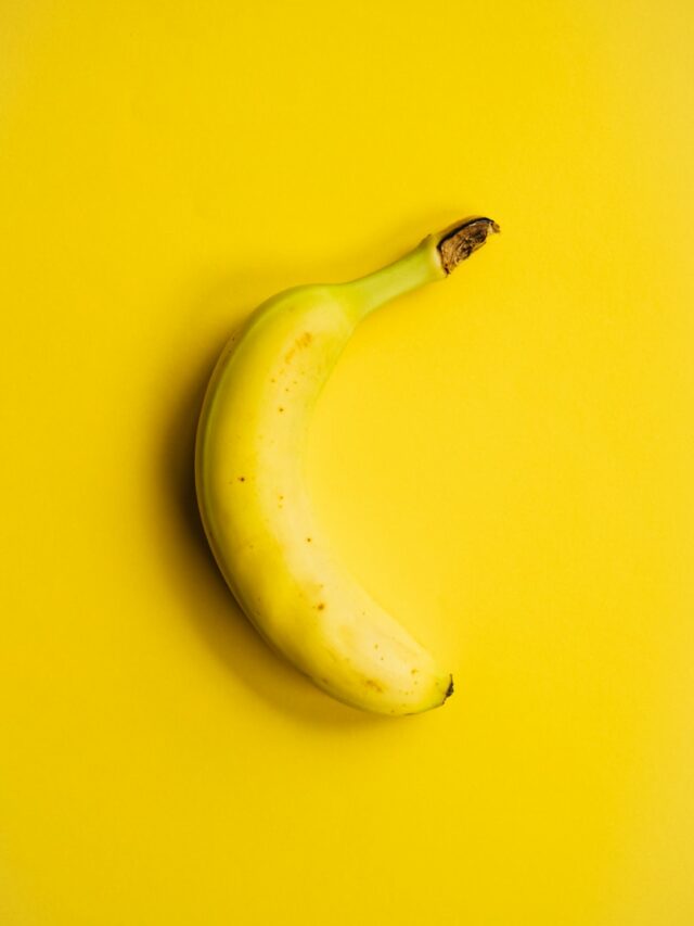 yellow banana fruit on yellow surface