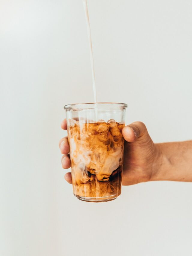 clear drinking glass with brown liquid