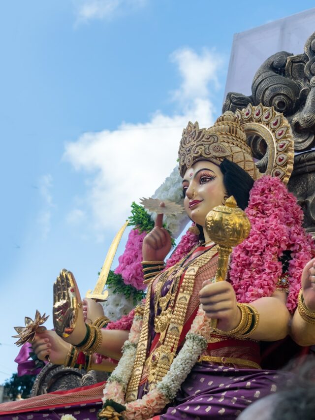 A statue of a woman sitting on top of a horse