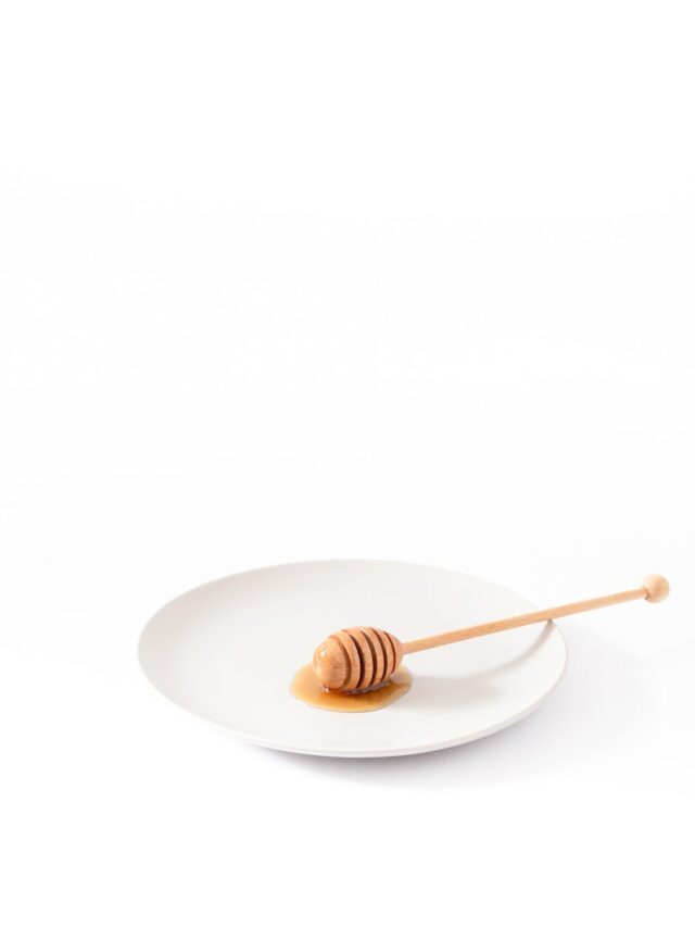 honey dipper on empty plate