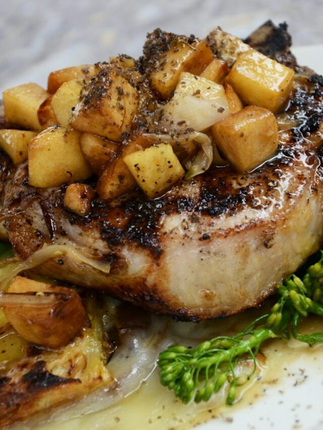 grilled steak with vegetables on white ceramic plate